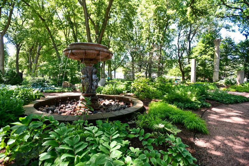 Lush green foliage thrives in the historic Column Garden at Governor Small Memorial Park on Thursday during the Kankakee Kultivators Garden Club annual Garden Tour & Artisan Faire held at the Kankakee County Museum. The Kultivators maintain the Column Garden as well as the Let Freedom Ring Garden on the museum grounds.