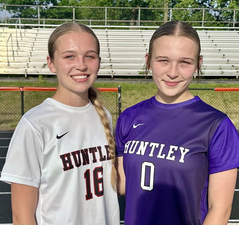 Brooke Grabs (left) scored in the fourth minute and twin sister Ashlyn Grabs (right) compiled 12 saves for Huntley during Friday's IHSA Class 3A sectional girls soccer final against Warren.