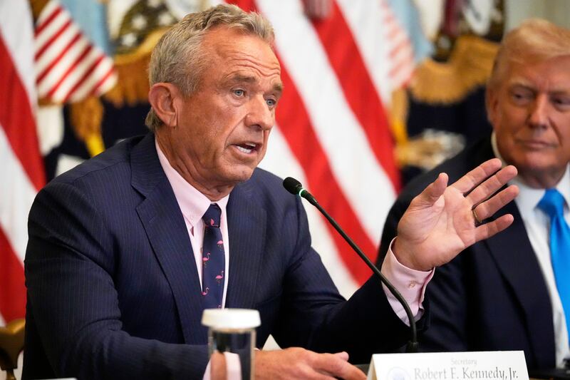 Health and Human Services Secretary Robert F. Kennedy Jr. speaks as President Donald Trump listens at an event to promote his proposal to improve Americans' access to their medical records in the East Room of the White House, Wednesday, July 30, 2025, in Washington. (AP Photo/Mark Schiefelbein)