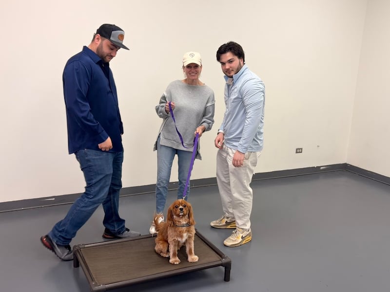 Zachary Holland, Amanda Marrazzo with her dog Vinnie, and Henry Schnur at Underdog Academy in Algonquin on March March 27, 2026.