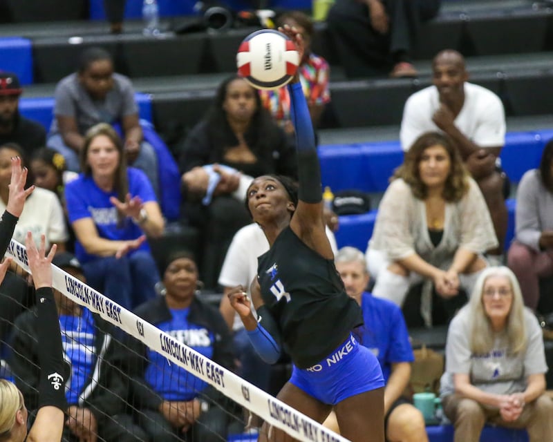 Lincoln-Way East's Klarke Mosby (4) hits a kill shot during volleyball match between Lockport at Lincoln-Way East. Oct 14, 2025.