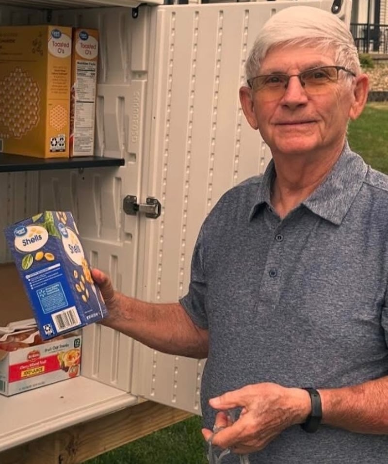 One River Zen community member Bob Carlson stocking Karuna Food Pantry shelves
