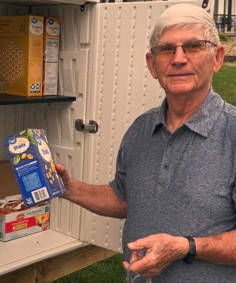 One River Zen community member Bob Carlson stocking Karuna Food Pantry shelves