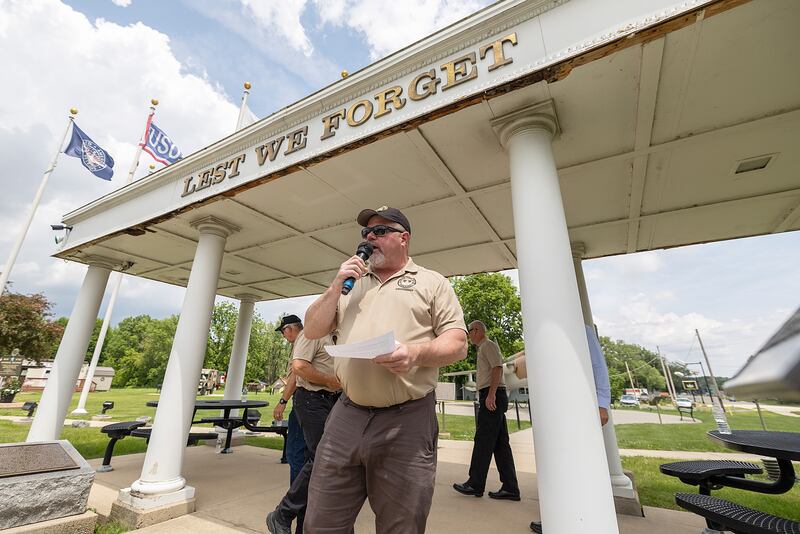 Veterans Park chairman Mike Mills starts a ceremony Sunday, June 8, 2025, in Dixon to unveil signage officially marking Dixon as a POW-MIA city.