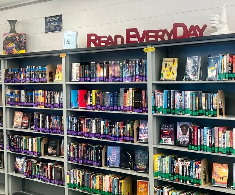 Books line the library shelves inside Sterling's Challand Middle School. District librarian Heather Johnson recently secured a grant awarding the school a special collection of books.
