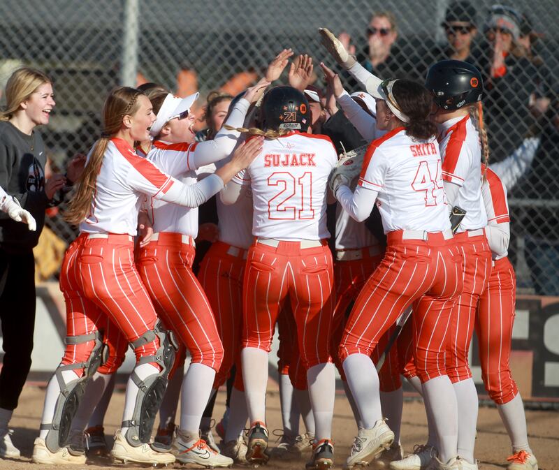 St. Charles East players celebrate Hayden Sujack’s homerun during a game against St. Charles North at St. Charles East on Friday, April 19, 2024.