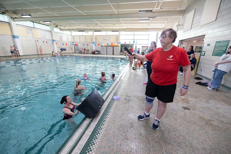 Sterling-Rock Falls YMCA Aquatic and Youth Sports Director Deb Mortonson runs the Easter Egg Hunt Friday, April 11, 2025.