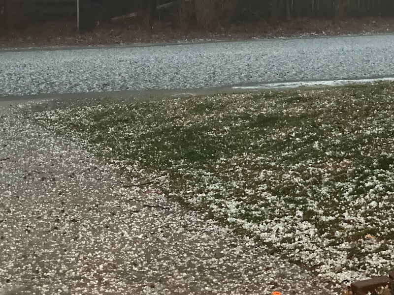 Hail covers the grass on a lawn on Tuesday, March 10, 2026 in Princeton.