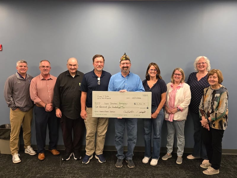 Pictured from left to right: Dr. Jason Harper – superintendent, Tony Doyle – assistant superintendent, Kevin Zilm – Crawford board vice president, Todd Prusator – Crawford board president, Dennis Orlikowski – VFW Post #3878 commander, Jill Schwartz – Crawford board treasurer, Holli Duthie – Crawford board member, Donna Drought – Crawford board secretary and Pat Casey – Crawford board member.
