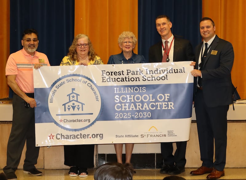 Joliet Public Schools District 86 Board of School Inspectors President Jesse Smith, Superintendent Dr. Theresa Rouse, Forest Park I.E. School Principal Jacob Darley, and Academic Advisor Ryan Martinsen accept the Illinois School of Character banner from University of St. Francis Professor Emerita, and Coordinator, Illinois Schools of Character, Dr. Madonna Murphy.
Wednesday, May 28, 2025.