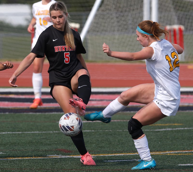 Huntley's Maizie Nickle tries to control the ball in front Jacobs' Clare Leib during the IHSA Class 3A Huntley Girls Soccer Regional championship match on Friday, May 23, 2025, at Huntley High School.