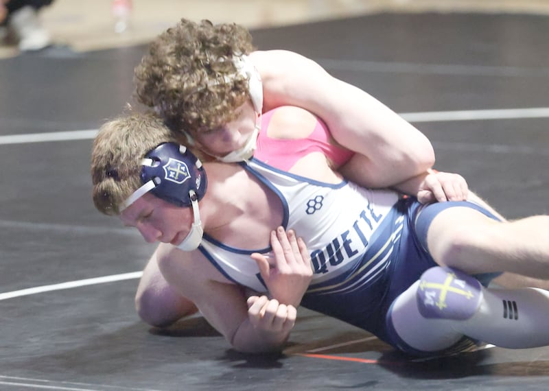 Marquette's Logan Parini wrestles Bradley-Bourbonnias's Coen Mcgill on Wednesday, Jan. 14, 2026 in Bader Gymnasium at Marquette Academy.