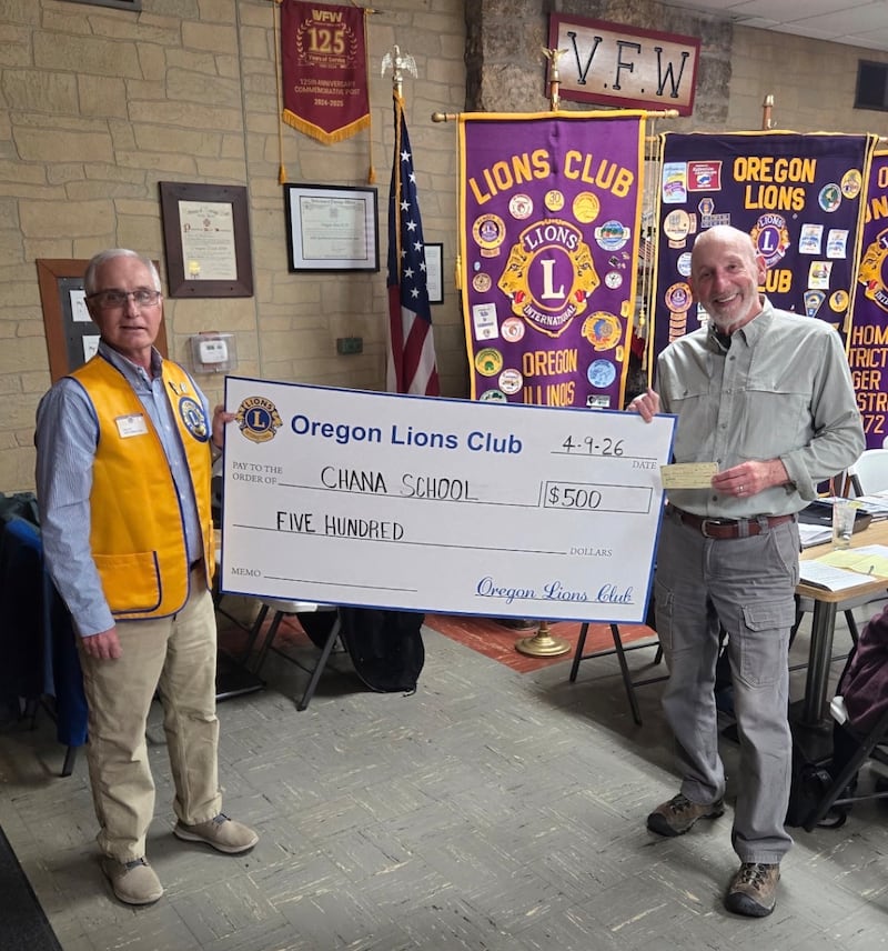 The Oregon Lions Club recently donated $500 to the Chana Education Center. Presenting is Lion President Grant Afflerbaugh and accepting is Mark Herman.