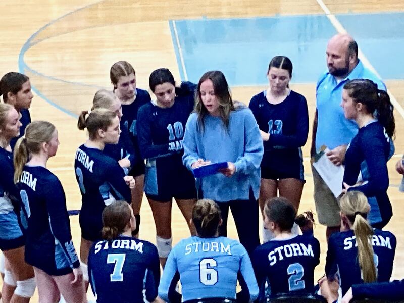 Bureau Valley coach Saige Barnett works the Storm bench between games in Monday's season opener at the Storm Cellar with Newman. The Comets won 25-23, 25-16.
