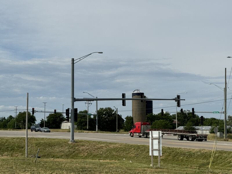 From left to right, a black SUV, a gray car and a red semi wait for the light to change at the corner of Brisbin Road and Route 6 east of Morris, outside the Love's Travel Stop.