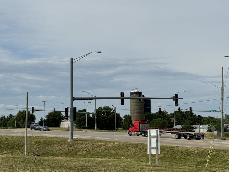 From left to right, a black SUV, a gray car and a red semi wait for the light to change at the corner of Brisbin Road and Route 6 east of Morris, outside the Love's Travel Stop.