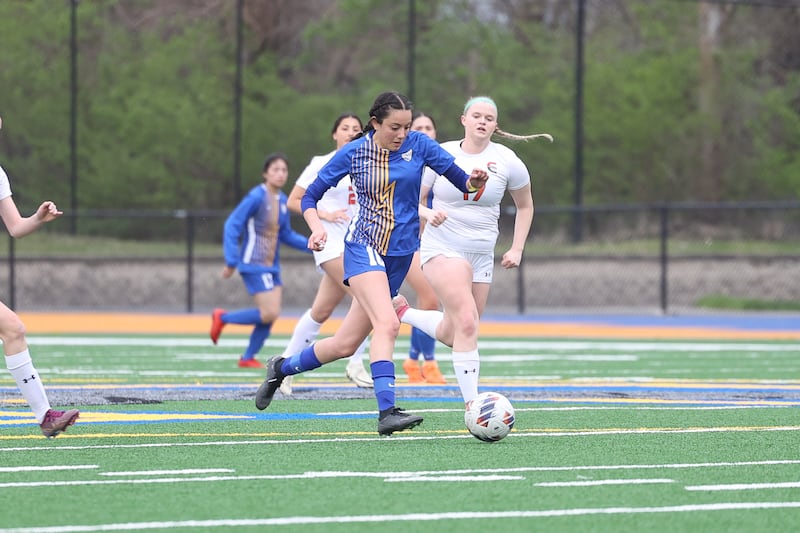Joliet Central’s Victoria Davila works the ball midfield against Plainfield East on Thursday, April 11, 2024.