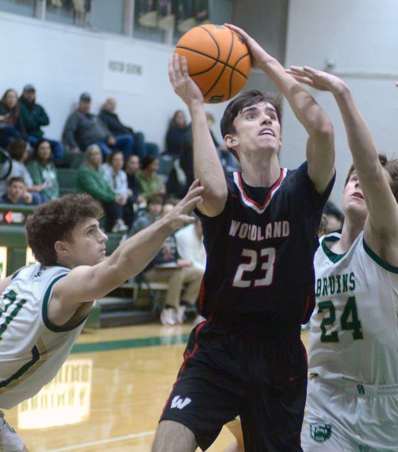 Woodland’s Nick Plesko splits the defense of St Bede’s August Burr and Phillip Gray in the first quarter of a game earlier this season at St Bede.