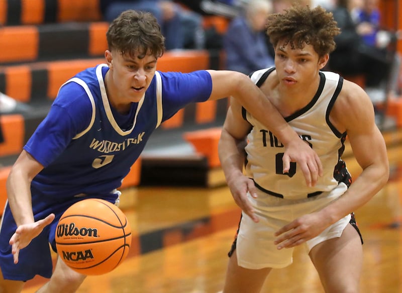 Woodstock's Max Beard drives to the basket against Crystal Lake Central's JR Mason during a nonconference boys basketball game on Monday Jan. 5, 2026, at Crystal Lake Central School.