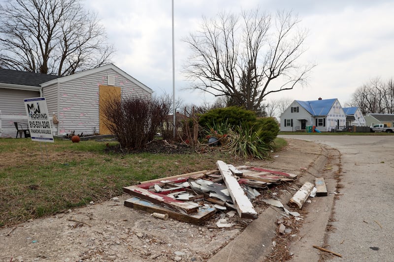 Debris is piled on the curb near damaged homes along NW Circle Drive in Bradley on March 26, 2026, following the March 10 storms that passed through Kankakee County.