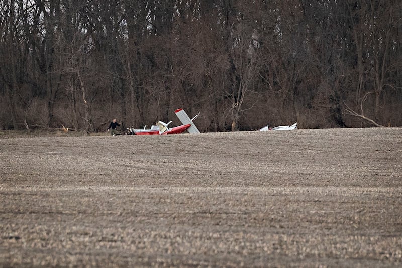 Investigators work at the scene of a plane crash in Rock Falls on Friday, March 20, 2026. One person was pronounced dead at the scene.
