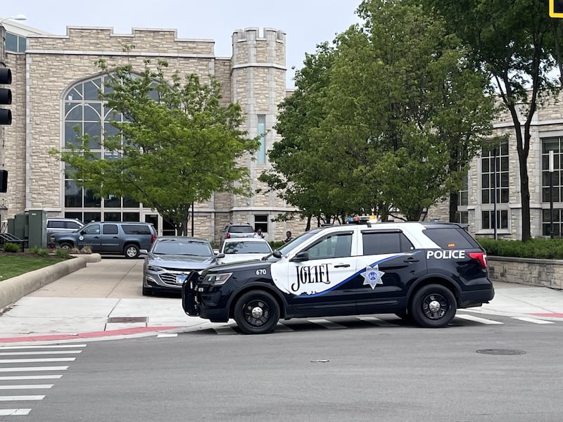 A Joliet police car sits outside Joliet Central High School, 201 E. Jefferson St., as the school was briefly placed on lockdown on Tuesday, May 12, 2026.