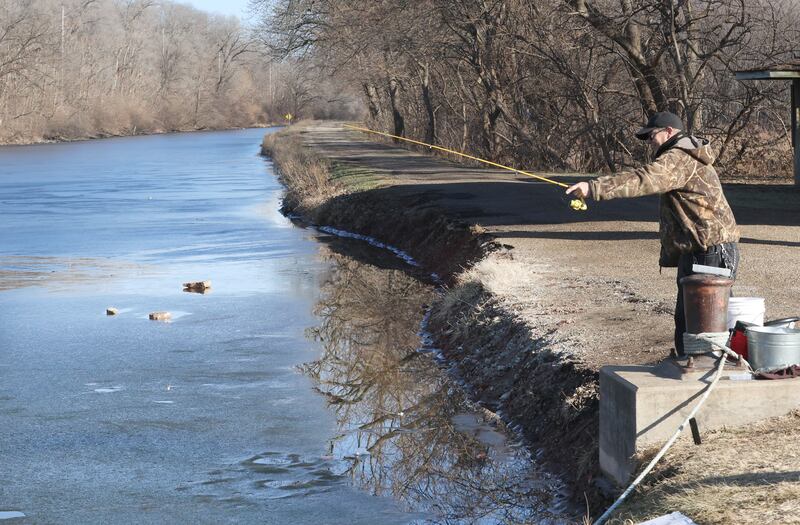 John Twardowski of La Salle, fishes on the shore of the Illinois & Michigan Canal on Wednesday, Jan. 7, 2026 at Lock 14 in La Salle. The canal has an extreamly thin layer of ice on it. Normally the canal is froze solid this time of year.