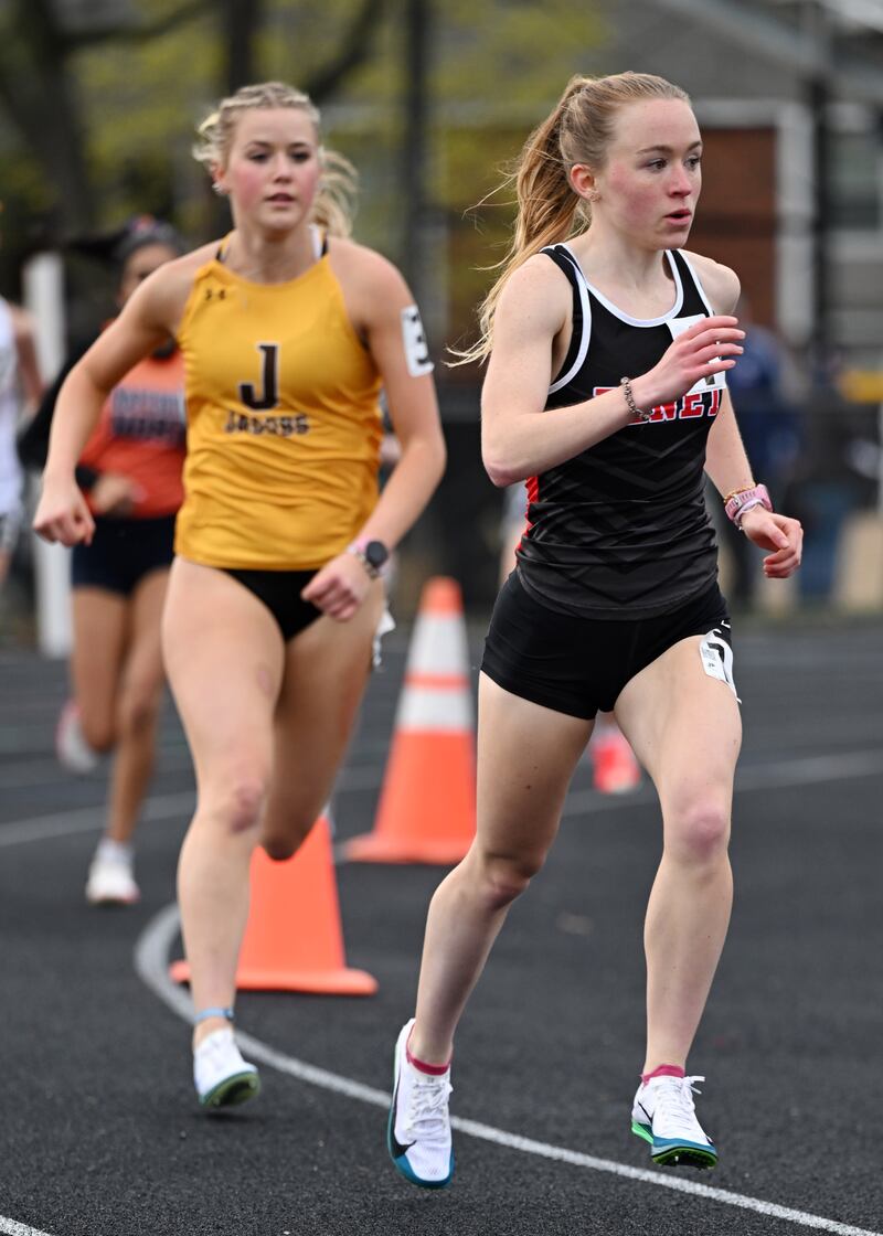 Benet Academy’s Delilah Helenhouse, right, won the 3,200-meter run during the Naperville North Gus Scott boys and girls track and field meet on Thursday, April 17, 2025 in Naperville.