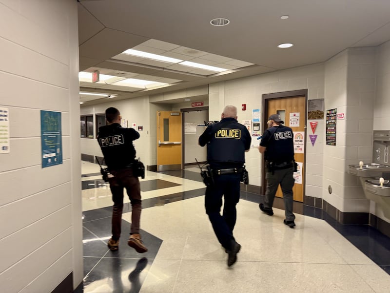 A three man coordinated response team evaluate the area at Parkside in Peru during an active shooting simulation.