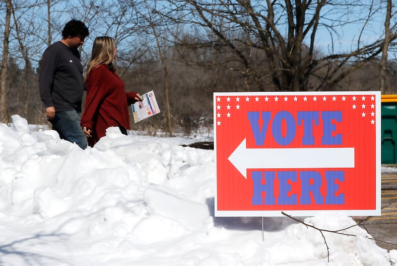 Voters in walk out of the Nippersink Public Library in Richmond on Tuesday, March, 17, 2026, after casting their ballots in the Illinois primary election.