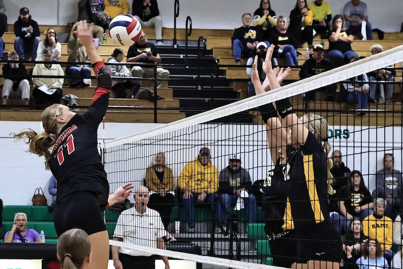 Erie-Prophetstown's Lauren Abbott hammers the ball past Riverdale's Cayleigh Hungate (right) and Preslie Willemkens at Rock Falls High School on Thursday, Oct. 30, 2025, during the Regional Championship game. The Rams were able to win the Regional in two sets.