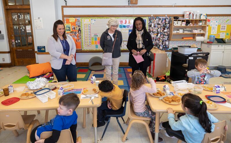 Wallace School acting director Amber Stavenger (left), Stacy Flanagan and Connie Marney speak with students Thursday, Jan. 23, 2025, during lunch hour at the Tri-County Opportunities Council Early Head Start/Head Start program in Sterling. Flanagan, filling in for State Rep. Brad Fritts and Marney, for State Rep. Tony McCombie, toured the Sterling school to learn about the workings and needs of the Head Start and Early Head Start program.
