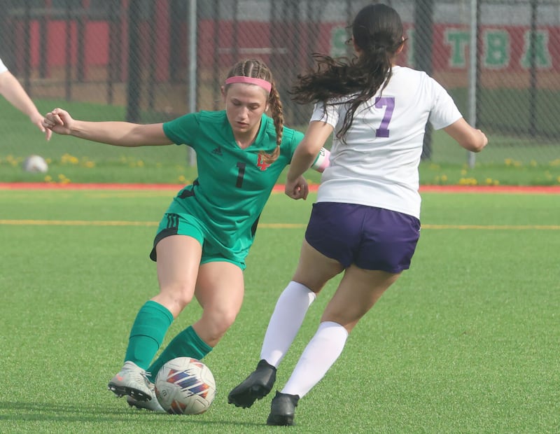 L-P's Addie Dawson keeps the ball away from Rochelle's Evelyn Garcia on Wednesday, April 15, 2026 at the L-P Athletic Complex in La Salle.