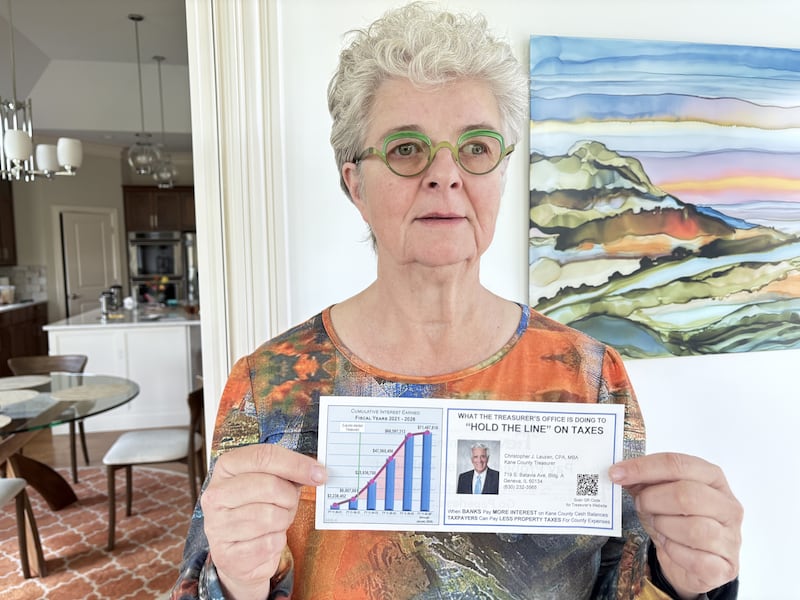 St. Charles resident Dimitra Rizzi holds an insert that was included with the May 1 Kane County property tax bill. Rizzi filed complaints to the Kane County State's Attorney and the Illinois Board of Elections, alleging that the insert from Kane County Treasurer Chris Lauzen may serve as a campaign tool rather than a standard administrative notice.