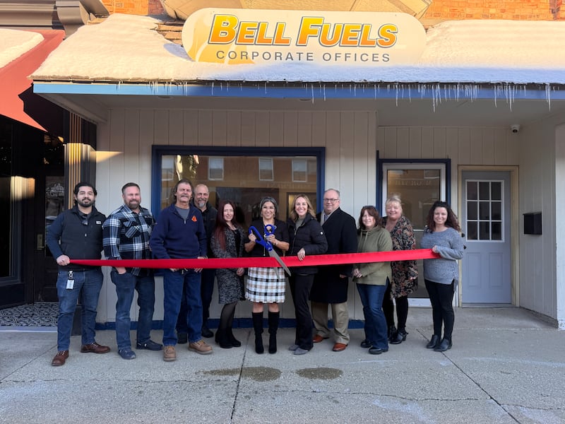 Bell Fuels Owner Stella Gaytan cuts the ribbon at the Grundy County Chamber ribbon cutting on Dec. 8 for their new office in downtown Morris. The Bell Fuels team, City of Morris representatives, Grundy Chamber staff, and Ambassadors all celebrated the new office.