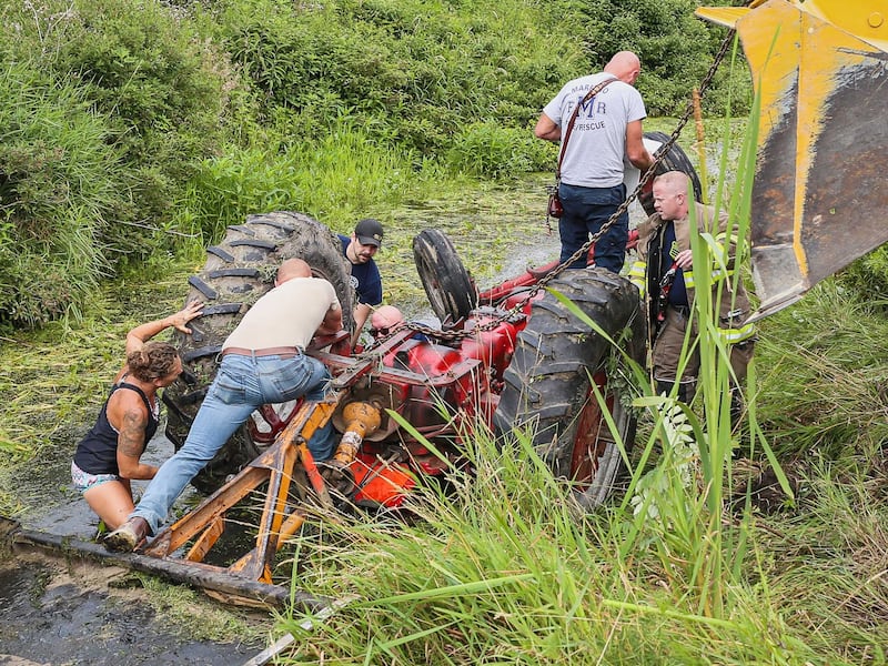 Harvard firefighters, along with Bob Dodson's family and neighbors, were able to free the man pinned under a tractor within 25 minutes after first-responders arrived on July 20, 2025.