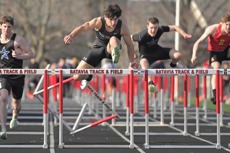 Kaneland’s Luke Gadomski wins the 110-meter hurdles despite knocking down a hurdle at a boys track and field invitational at Batavia High School on Friday, April 11, 2025.