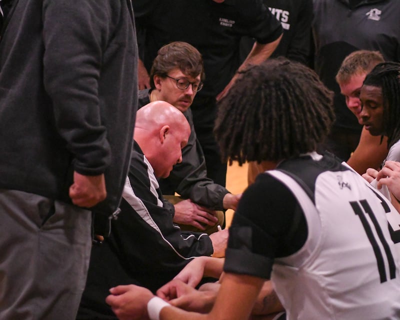 Kaneland's head coach Ernie Colombe talks with the team between quarters on Wednesday Dec. 11, 2024, while taking on Sycamore High School held at Kaneland High School in Maple Park.