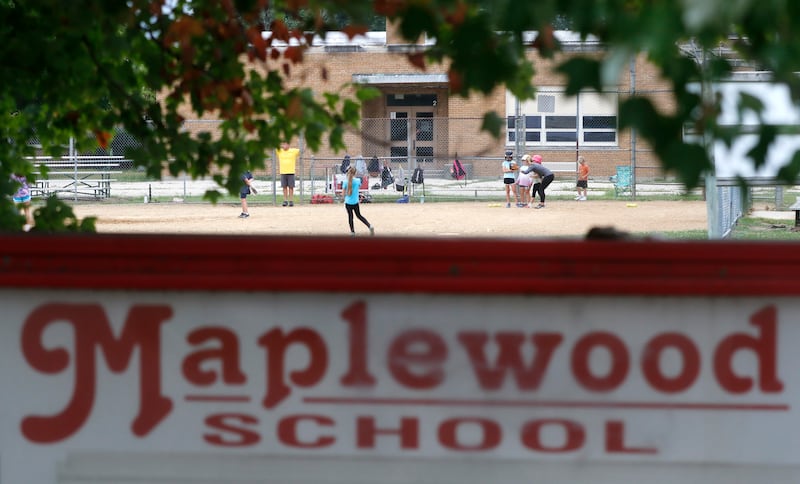 Children practice on a ball field at Maplewood Elementary School on Wednesday, Sept. 6, 2023. Members of the Cary School District 26 Board of Education voted on a transportation project site design concept and project timeline that paves the way for Maplewood Elementary School to be tore down and the construction of new and larger transportation center.