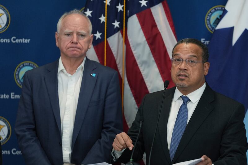 Attorney General Keith Ellison, right, and Minnesota Gov. Tim Walz give a news conference in Blaine, Minn., Sunday, Jan. 25, 2026. (AP Photo/Abbie Parr)