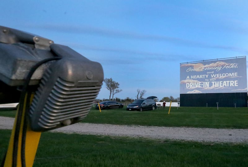 The sun sets over the Route 34 Drive-in on Friday, April 19, 2024 in Earlville. The Drive-In theater opened for the season this weekend.