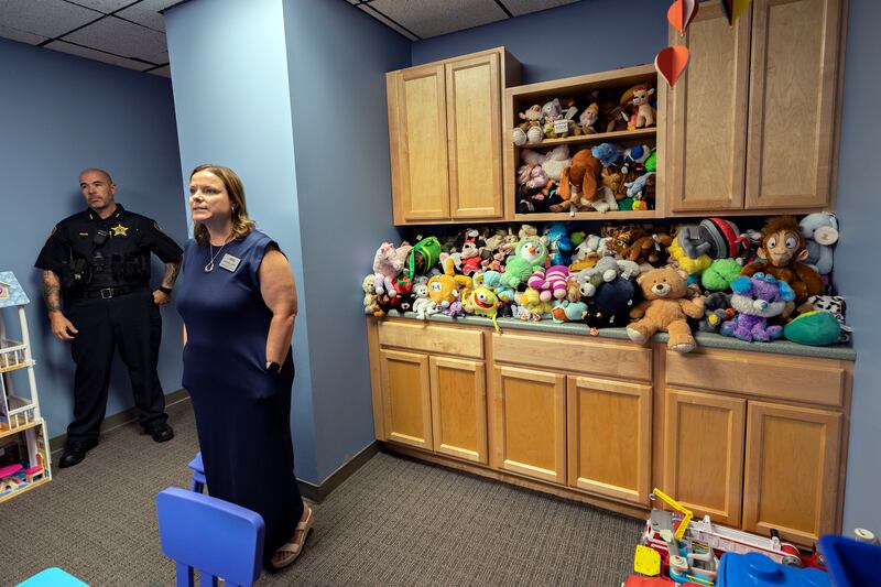 Shining Star Executive Director Jessica Cash speaks to advocates Wednesday, July 23, 2025, in a child’s waiting room during an open house at the child advocacy center.