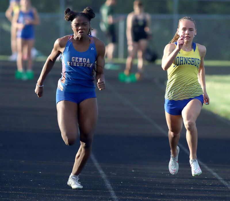 Genoa-Kingston’s Natasha Bianchi, left, and Johnsburg’s Hope Klosowicz run the 100-meter dash in IHSA Class 2A Girls Sectional Track action at Genoa-Kingston School in Genoa on Friday, May 16, 2025.