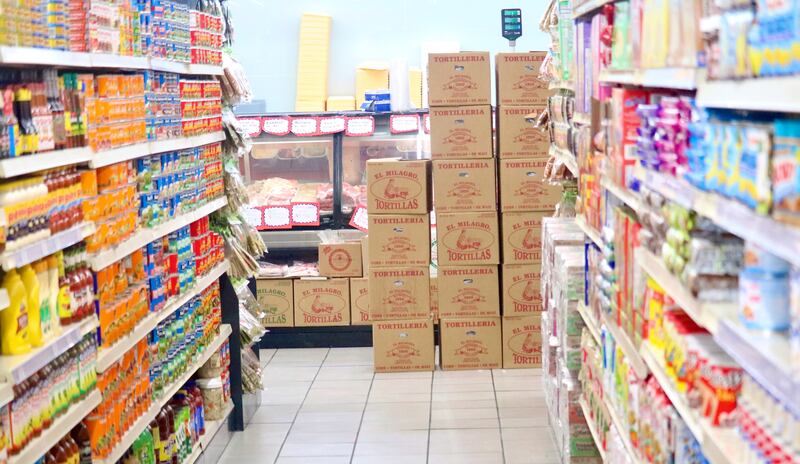 Condiments and canned goods line the shelves on Monday, Feb. 10, 2025, at DeKalb Fresh Market, 615 Oak St., DeKalb. Increased tariffs ordered by President Donald Trump's administration could impact local shoppers and businesses, including the price of groceries, experts have said.