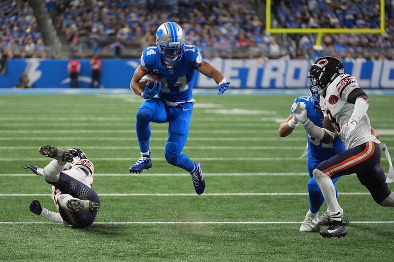 Detroit Lions wide receiver Amon-Ra St. Brown (14) runs against the Chicago Bears during the second half of an NFL football game in Detroit, Sunday, Sept. 14, 2025. (AP Photo/Paul Sancya)