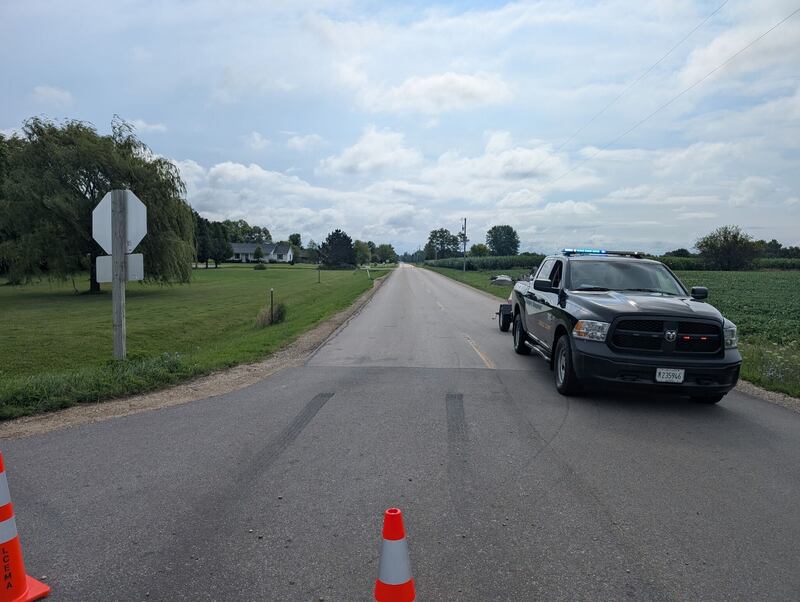 Roads are blocked off in rural Sheridan after authorities have confirmed two people were found dead after first responders rushed to an early-morning fire Thursday in rural Sheridan. A suspect is being sought.