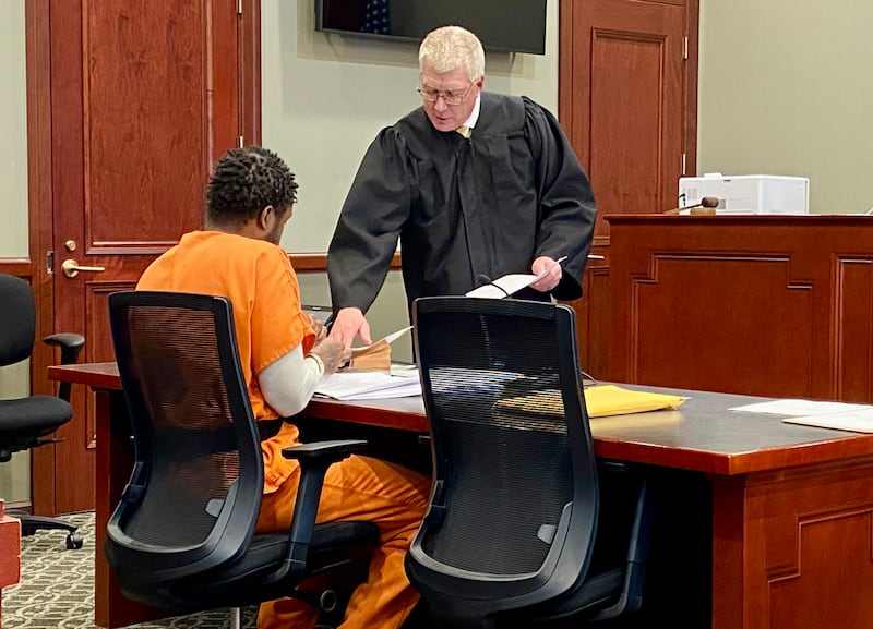 Matthew L. Martin (left) listens as DeKalb County Circuit Court Judge Philip Montgomery explains how jury instruction will work in a pretrial hearing on Wednesday, April 2, 2025, at the DeKalb County Courthouse in Sycamore. Martin, 44, of Chicago, is charged in a July 2024 DeKalb bank robbery and is expected to represent himself at trial beginning April 7.