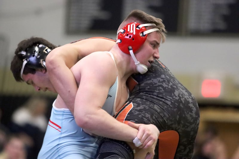 Marian’ Central's Jimmy Mastny, front, battles Washington’s Josh Hoffer at 215 pounds in varsity boys wrestling on Thursday, Feb. 5, 2026, at Sycamore High School in Sycamore.