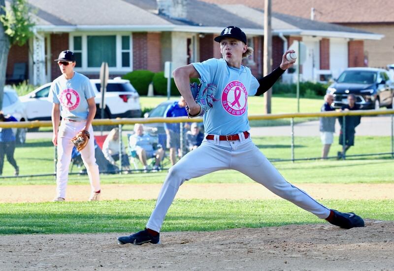 Hall senior Izzaq Zrust delivers a pitch Thursday at Kirby Park against Princeton. He picked up a 4-1 victory over the rival Tigers.