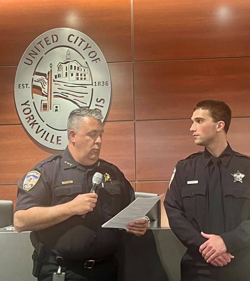 Yorkville Chief of Police James Jenssen swears-in their newest officer, Sam Tickle.